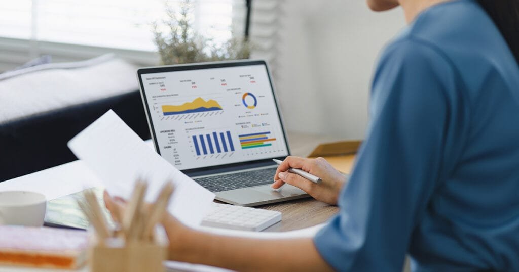 Fundraising manager working with generative ai to analyse marketing and donation data.