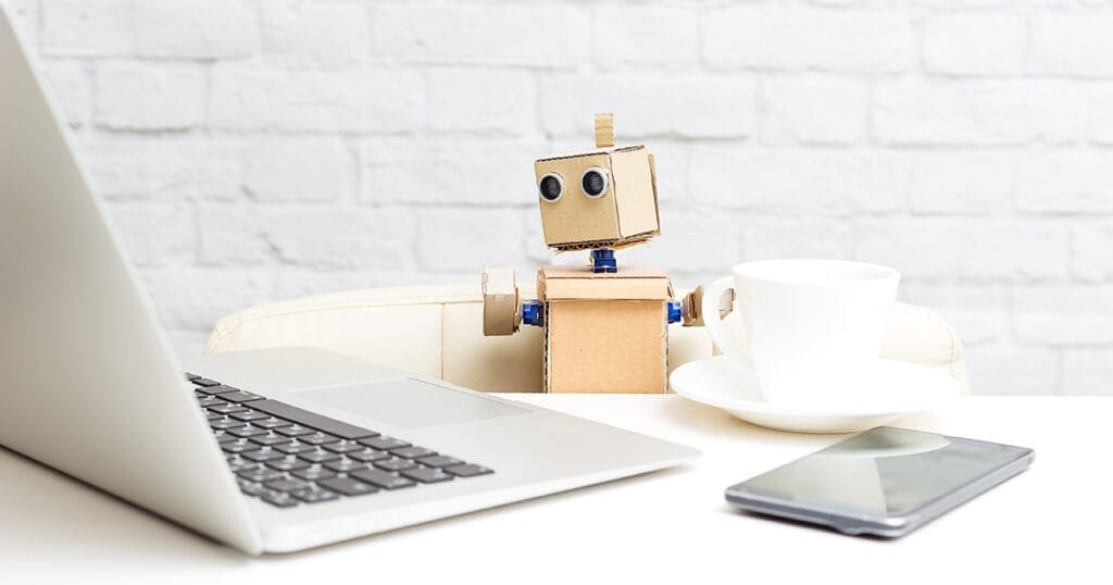 A robot with hands is sitting at the desk. Generative AI